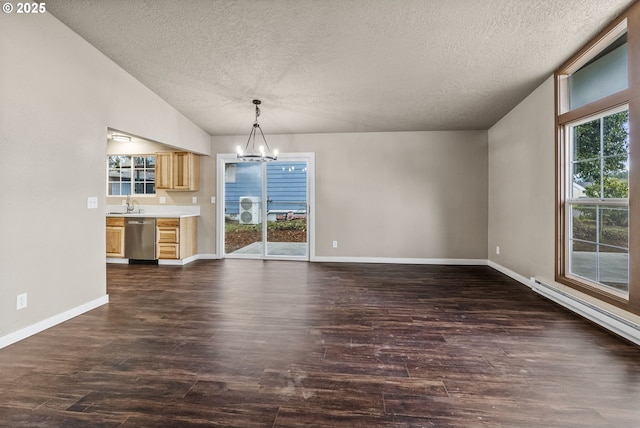 unfurnished dining area featuring lofted ceiling, a notable chandelier, a wealth of natural light, and dark hardwood / wood-style floors