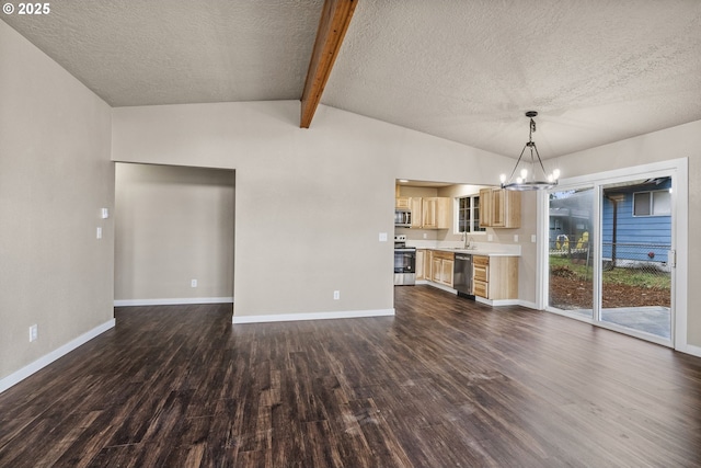 unfurnished living room featuring sink, dark wood-type flooring, an inviting chandelier, lofted ceiling with beams, and a textured ceiling