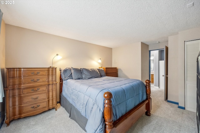 5160 SW 180th Ave Unit 17, Beaverton, OR 97078 - bedroom featuring light carpet, a closet, and a textured ceiling