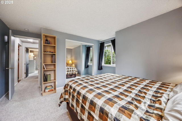 5160 SW 180th Ave Unit 17, Beaverton, OR 97078 - bedroom with light carpet, a closet, a textured ceiling, and baseboards