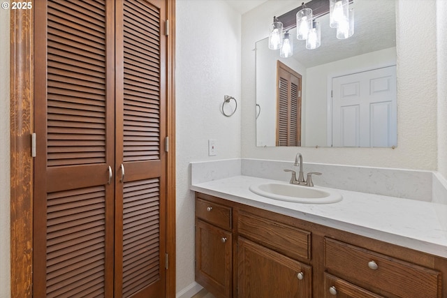 921 SE 168th Ave, Portland, OR 97233 - bathroom featuring vanity and a closet