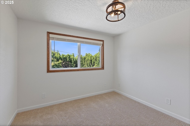921 SE 168th Ave, Portland, OR 97233 - empty room featuring carpet and a textured ceiling