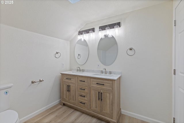 921 SE 168th Ave, Portland, OR 97233 - full bathroom featuring lofted ceiling, wood finished floors, and double vanity