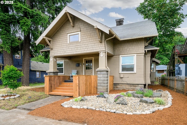 561 Madison St, Eugene, OR 97402 - view of front of property with a chimney, a porch, and roof with shingles