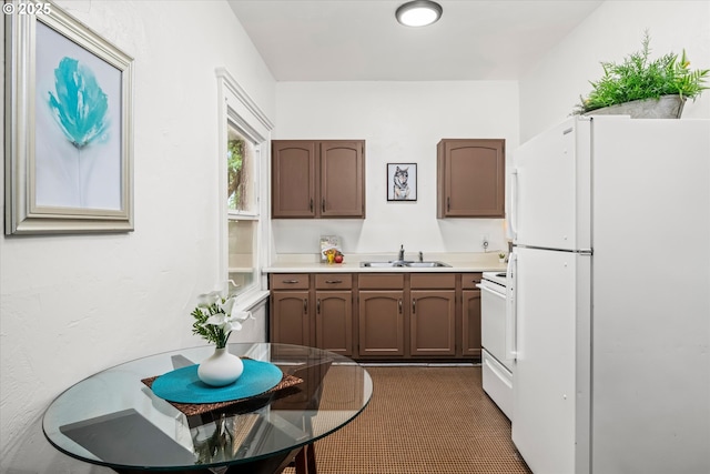 561 Madison St, Eugene, OR 97402 - kitchen with white appliances, a sink, and light countertops
