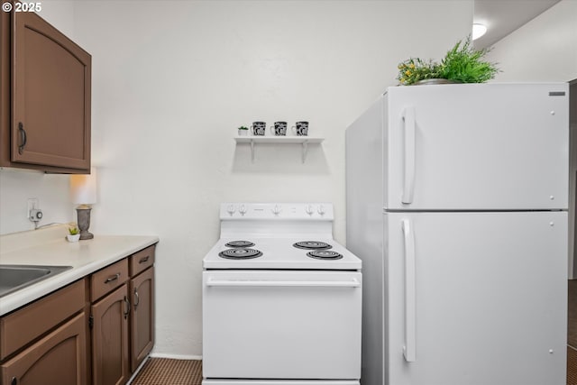 561 Madison St, Eugene, OR 97402 - kitchen featuring white appliances, light countertops, and open shelves