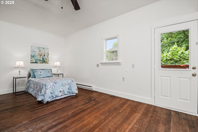 561 Madison St, Eugene, OR 97402 - bedroom featuring a baseboard heating unit, wood-type flooring, and baseboards