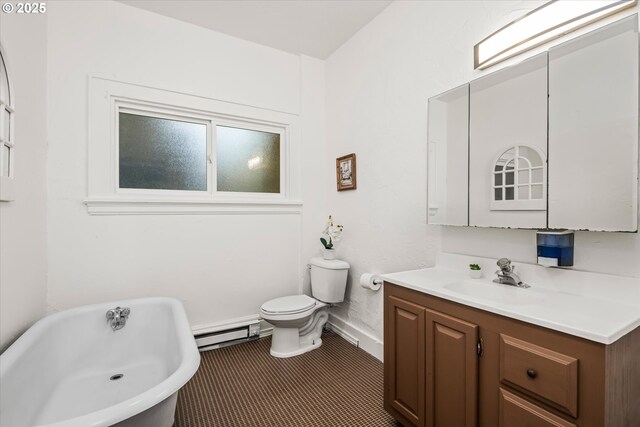 561 Madison St, Eugene, OR 97402 - full bathroom with a baseboard heating unit, a freestanding tub, vanity, and toilet
