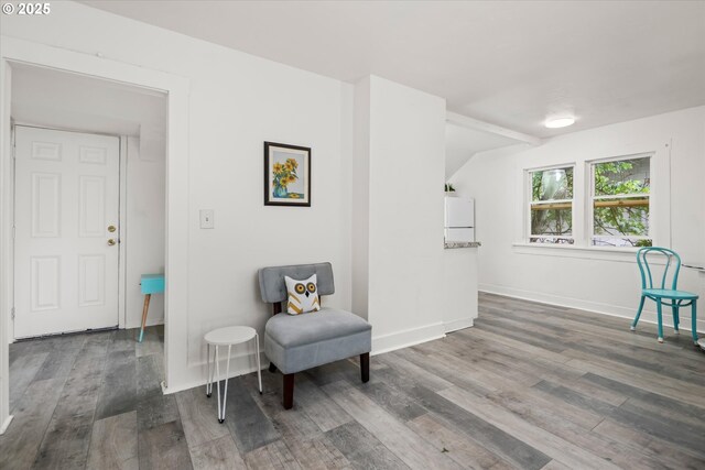 561 Madison St, Eugene, OR 97402 - living area with wood finished floors, baseboards, and vaulted ceiling