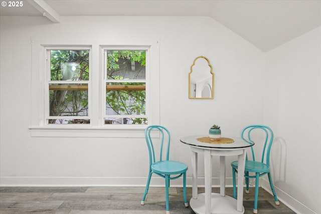561 Madison St, Eugene, OR 97402 - dining space with baseboards, wood finished floors, and vaulted ceiling
