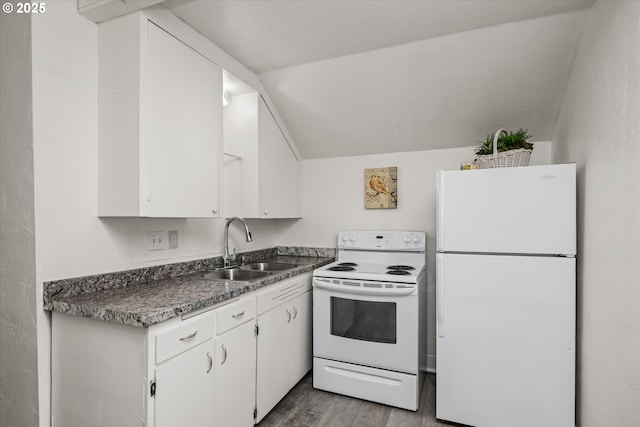 561 Madison St, Eugene, OR 97402 - kitchen featuring white appliances, a sink, white cabinets, wood finished floors, and lofted ceiling
