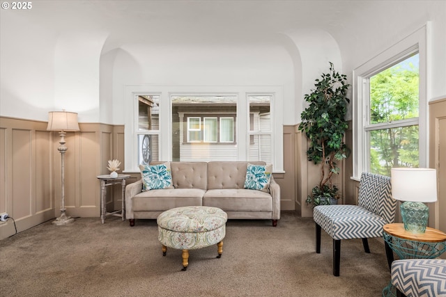 561 Madison St, Eugene, OR 97402 - carpeted living room with a decorative wall and wainscoting