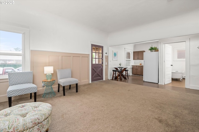561 Madison St, Eugene, OR 97402 - sitting room with a decorative wall, wainscoting, and carpet flooring