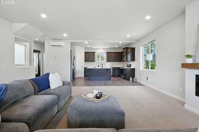 4236 E Willakenzie St, Newberg, OR 97132 - living room with a wall mounted air conditioner, recessed lighting, a glass covered fireplace, and carpet