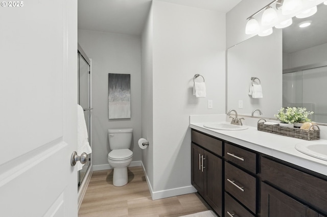 4236 E Willakenzie St, Newberg, OR 97132 - bathroom with wood finished floors, an enclosed shower, and double vanity