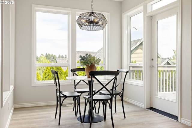 10695 SW Meier Dr, Tualatin, OR 97062 - dining space with light wood-style flooring and a chandelier