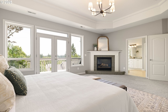 10695 SW Meier Dr, Tualatin, OR 97062 - carpeted bedroom with access to outside, a raised ceiling, multiple windows, a chandelier, and crown molding