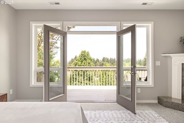 10695 SW Meier Dr, Tualatin, OR 97062 - doorway to outside with french doors, carpet, and a high end fireplace