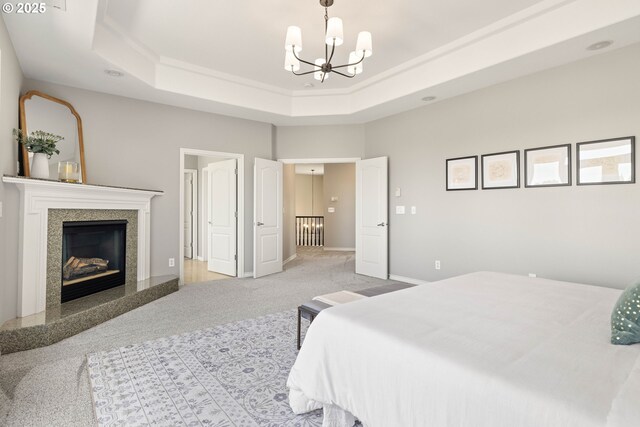 10695 SW Meier Dr, Tualatin, OR 97062 - carpeted bedroom with a chandelier, a tray ceiling, and a high end fireplace