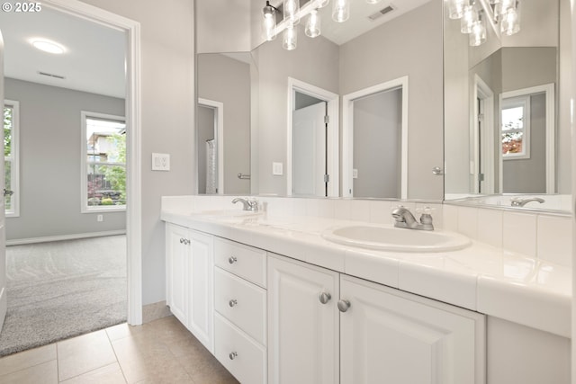 10695 SW Meier Dr, Tualatin, OR 97062 - full bath featuring double vanity and tile patterned flooring