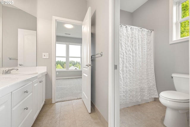 10695 SW Meier Dr, Tualatin, OR 97062 - full bathroom featuring vanity, plenty of natural light, tile patterned floors, and a shower with curtain
