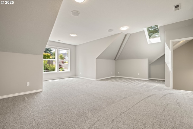 10695 SW Meier Dr, Tualatin, OR 97062 - additional living space with a skylight, carpet floors, and vaulted ceiling