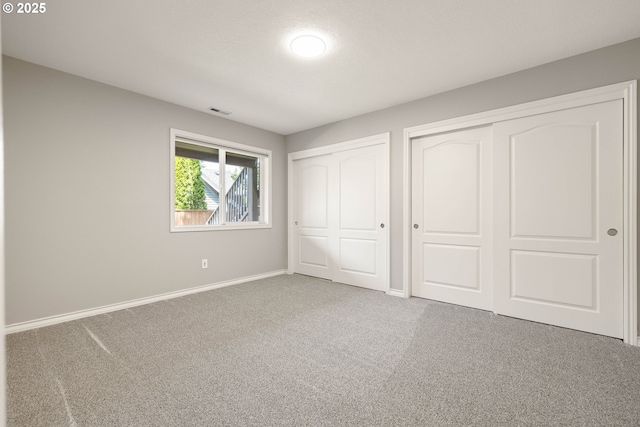 10695 SW Meier Dr, Tualatin, OR 97062 - unfurnished bedroom featuring multiple closets and carpet floors
