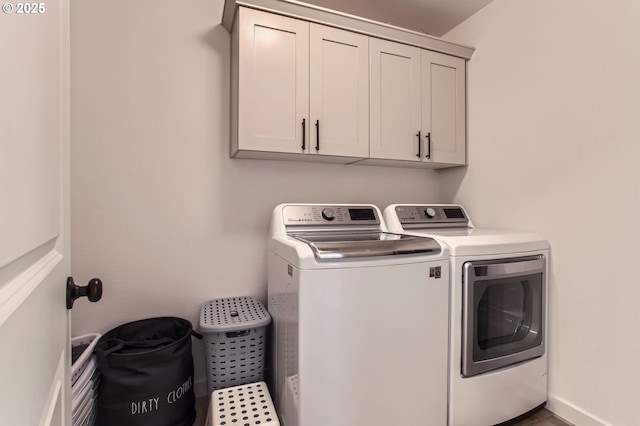 1319 S 29th Blvd, Cornelius, OR 97113 - laundry area featuring separate washer and dryer and cabinet space