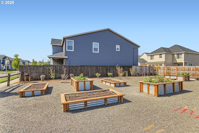 1319 S 29th Blvd, Cornelius, OR 97113 - view of playground with a garden, a fenced backyard, and a residential view