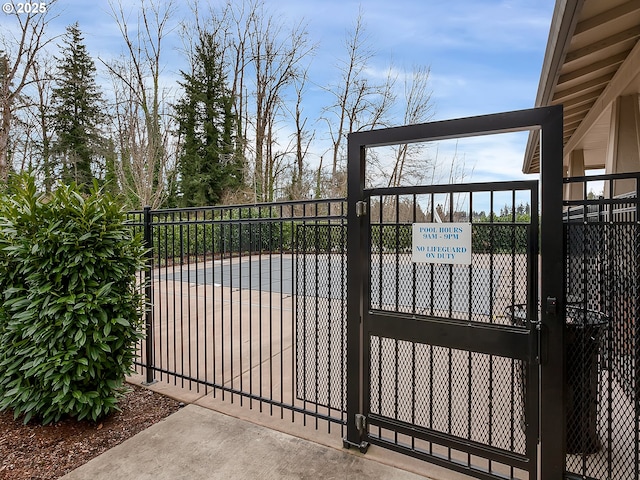 view of gate with fence