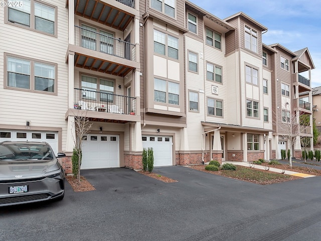 view of property with driveway and an attached garage