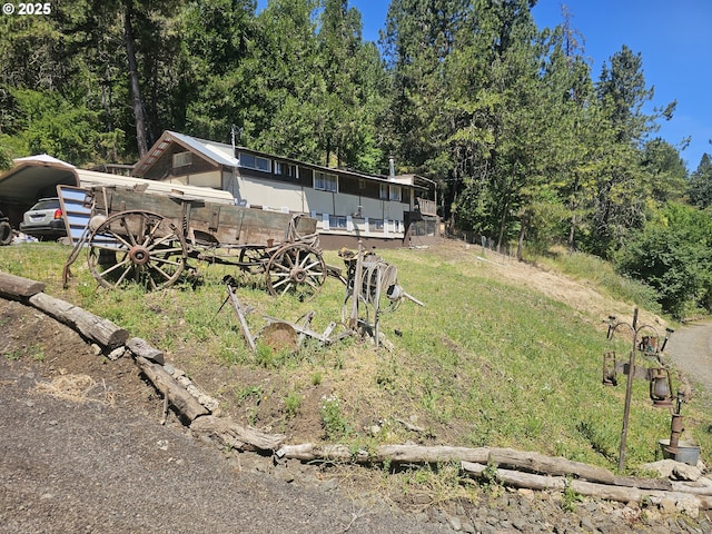 view of yard with a carport