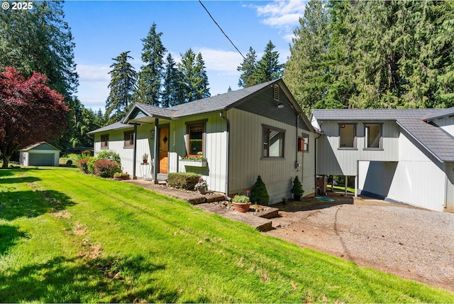 25465 S Beavercreek Rd, Beavercreek, OR 97004 - view of front of home featuring a front yard, an outdoor structure, and driveway