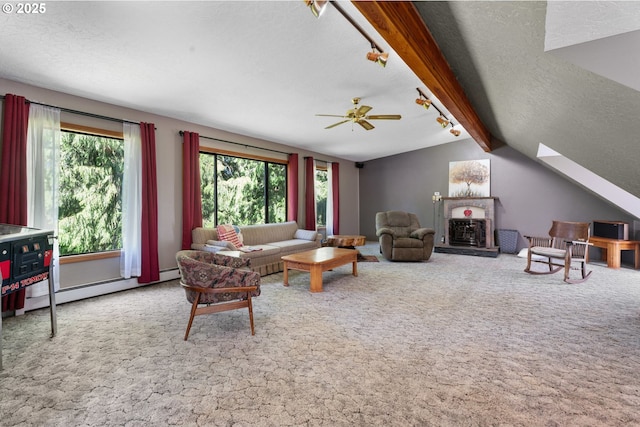 25465 S Beavercreek Rd, Beavercreek, OR 97004 - carpeted living area featuring a ceiling fan, a fireplace with raised hearth, a textured ceiling, and a skylight