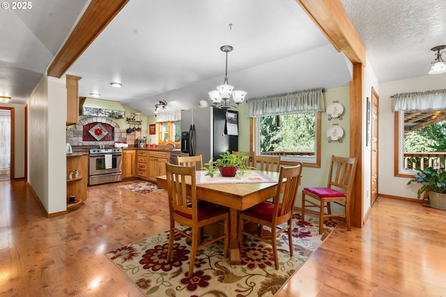 25465 S Beavercreek Rd, Beavercreek, OR 97004 - dining area featuring plenty of natural light, light wood-type flooring, a chandelier, and baseboards