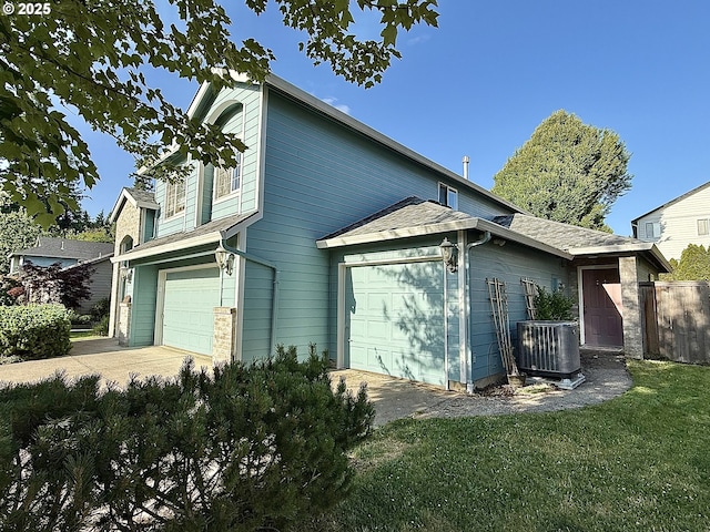 2942 NW Watkins Ct, Camas, WA 98607 - view of side of home featuring an attached garage and driveway
