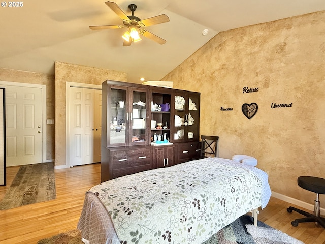 2942 NW Watkins Ct, Camas, WA 98607 - bedroom featuring wood finished floors, vaulted ceiling, a textured wall, and ceiling fan
