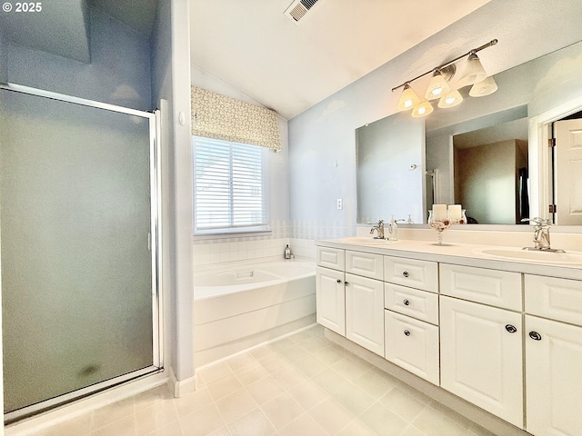 2942 NW Watkins Ct, Camas, WA 98607 - bathroom featuring vaulted ceiling, a stall shower, double vanity, tile patterned flooring, and a bath