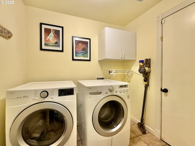 2942 NW Watkins Ct, Camas, WA 98607 - laundry room with washing machine and clothes dryer, cabinet space, and light tile patterned floors