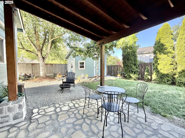 2942 NW Watkins Ct, Camas, WA 98607 - fenced backyard featuring an outdoor fire pit, an outbuilding, and a patio