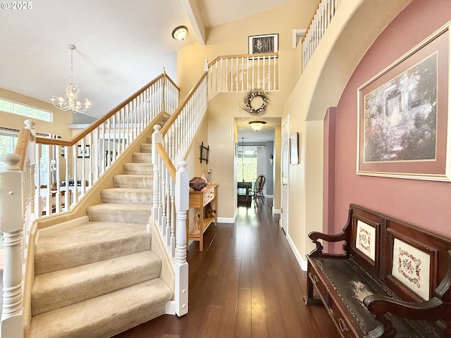 2942 NW Watkins Ct, Camas, WA 98607 - entryway featuring healthy amount of natural light, stairway, dark wood finished floors, a chandelier, and a high ceiling