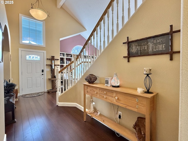 2942 NW Watkins Ct, Camas, WA 98607 - foyer entrance featuring high vaulted ceiling, stairway, dark wood finished floors, and beam ceiling