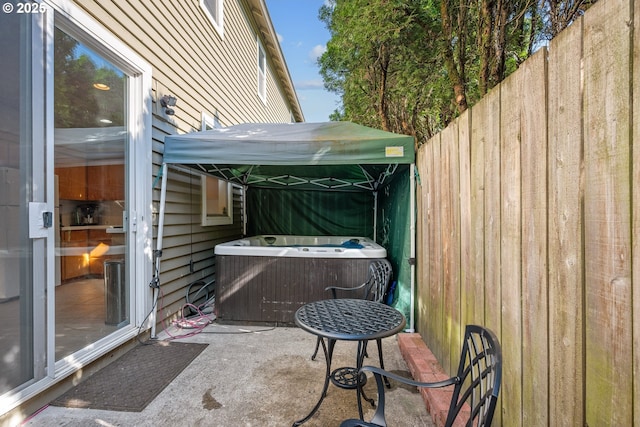 view of patio with fence and cooling unit