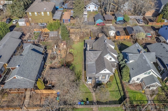 birds eye view of property with a residential view