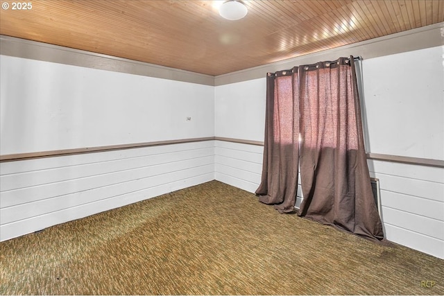 unfurnished room with wood ceiling, carpet flooring, and wood walls