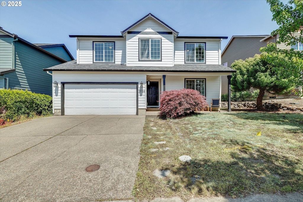 1034 E 14th St, Lafayette, OR 97127 - traditional-style home with driveway, an attached garage, a front lawn, and a shingled roof