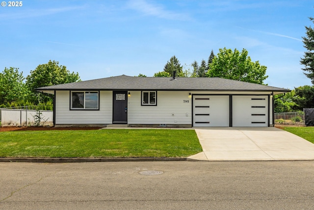 ranch-style house with fence, a front lawn, and a garage