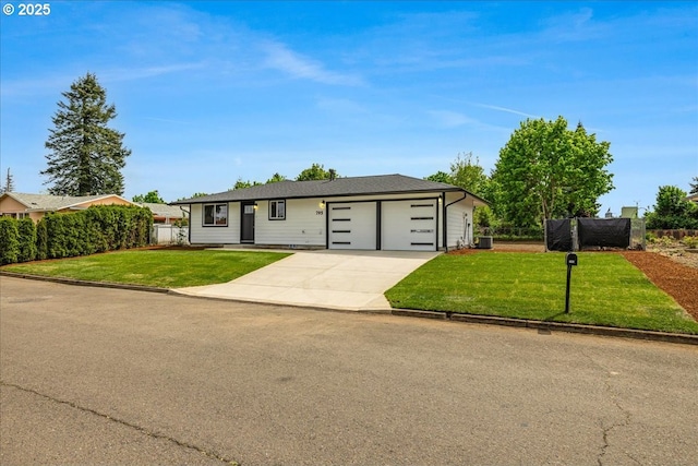 ranch-style home with an attached garage, fence, a front yard, and concrete driveway