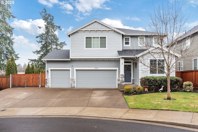 view of front of home with a garage and a front lawn