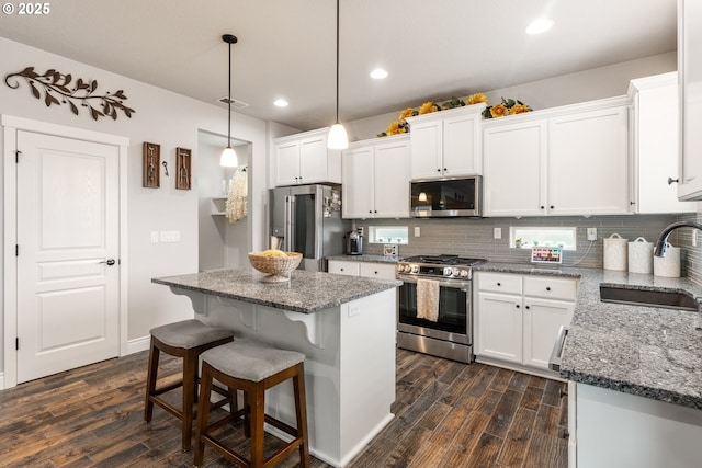 kitchen featuring white cabinetry, appliances with stainless steel finishes, and sink